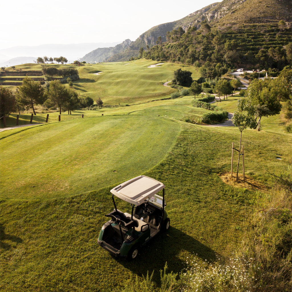 A hole with a buggy next to it with fairway in background at La Galiana Golf Course