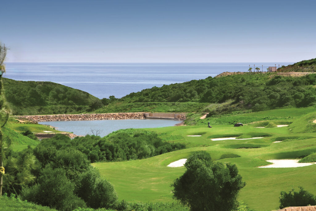 Fairway with bunkers and water hazard at La Hacienda Alcaidesa Links Golf Resort - Heathland Course