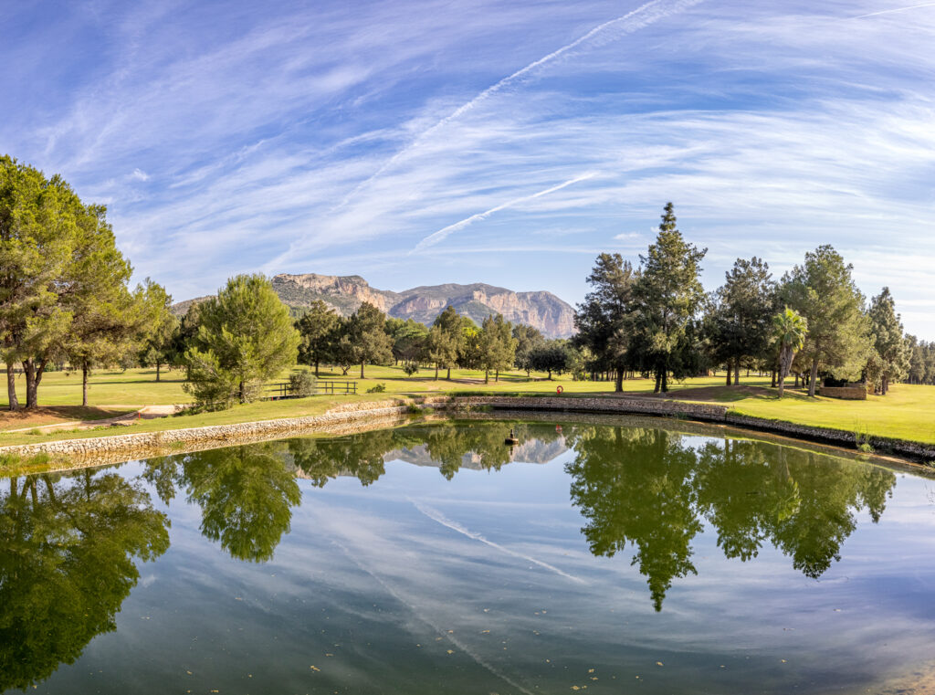 Lake on fairway with trees around at La Sella Golf Course