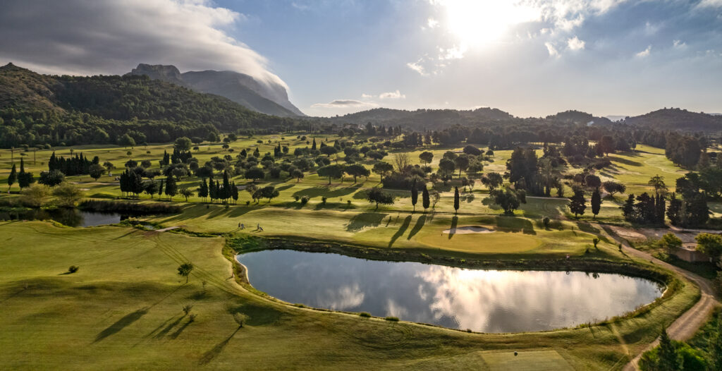 Lake on fairway with trees around at La Sella Golf Course