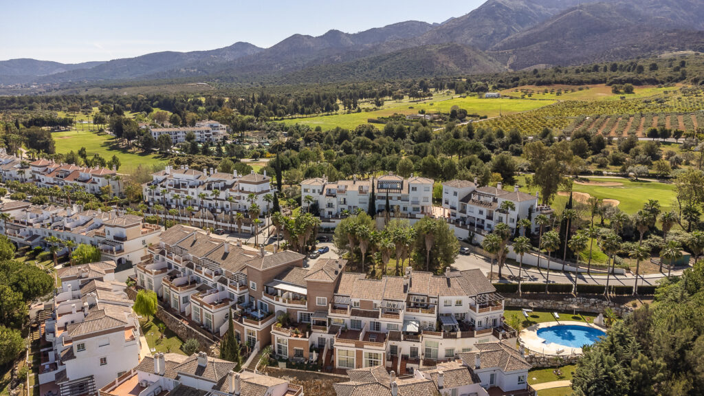 Aerial view of buildings by Lauro Golf Course