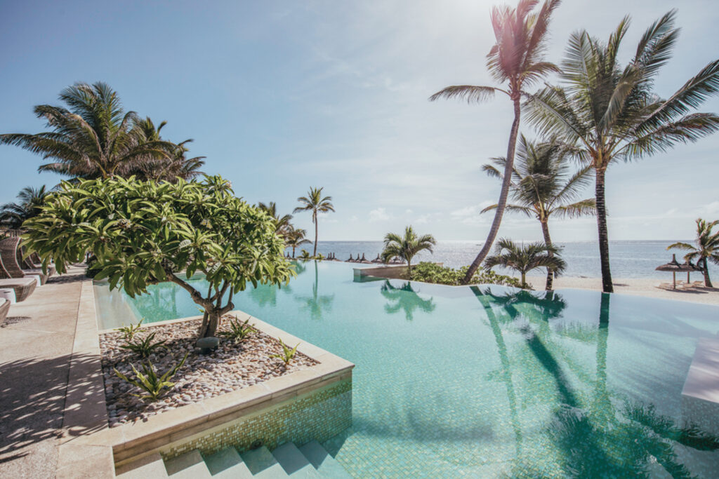 Outdoor pool at Long Beach (Sunlife Resort) with palm trees