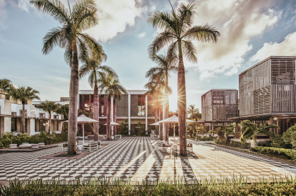 Exterior of Long Beach (Sunlife Resort) with palm trees