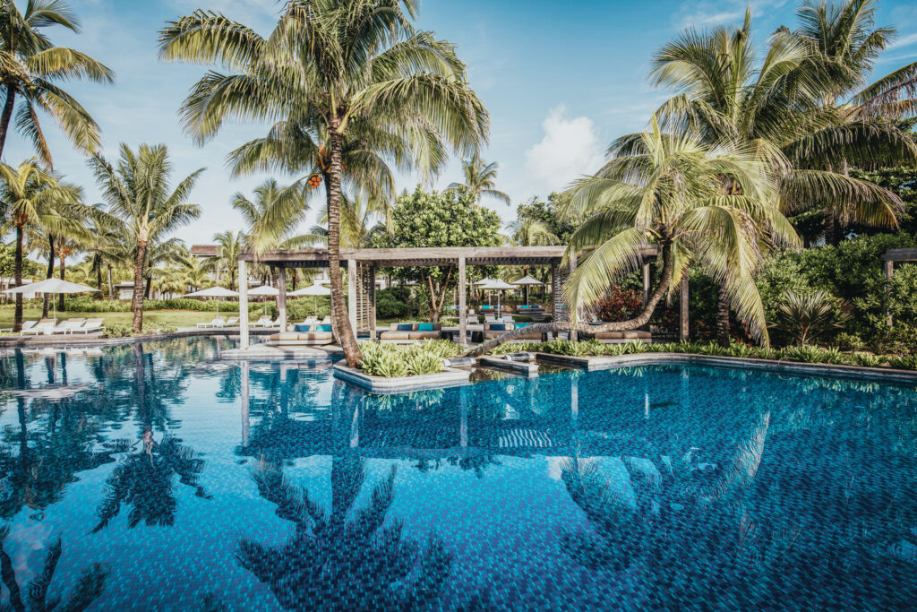 Outdoor pool at Long Beach (Sunlife Resort) with palm trees