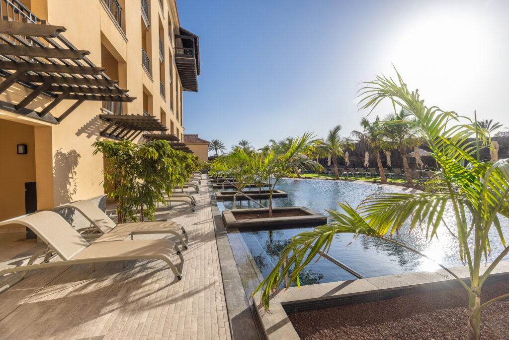 Lopesan Costa Meloneras Resort & Spa swimming pool with loungers