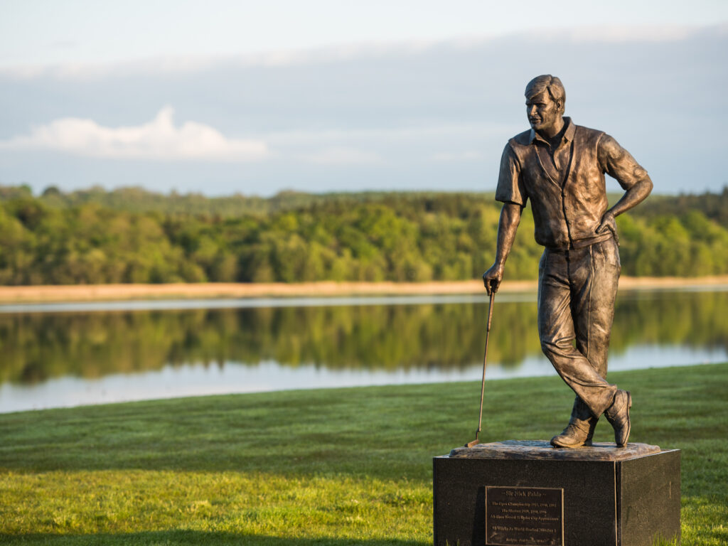 Golf statue at Lough Erne Resort with lake in background