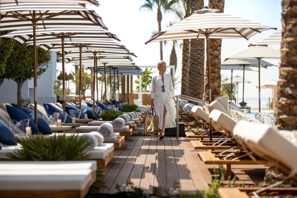 Loungers with umbrellas at METT Hotel Beach Resort