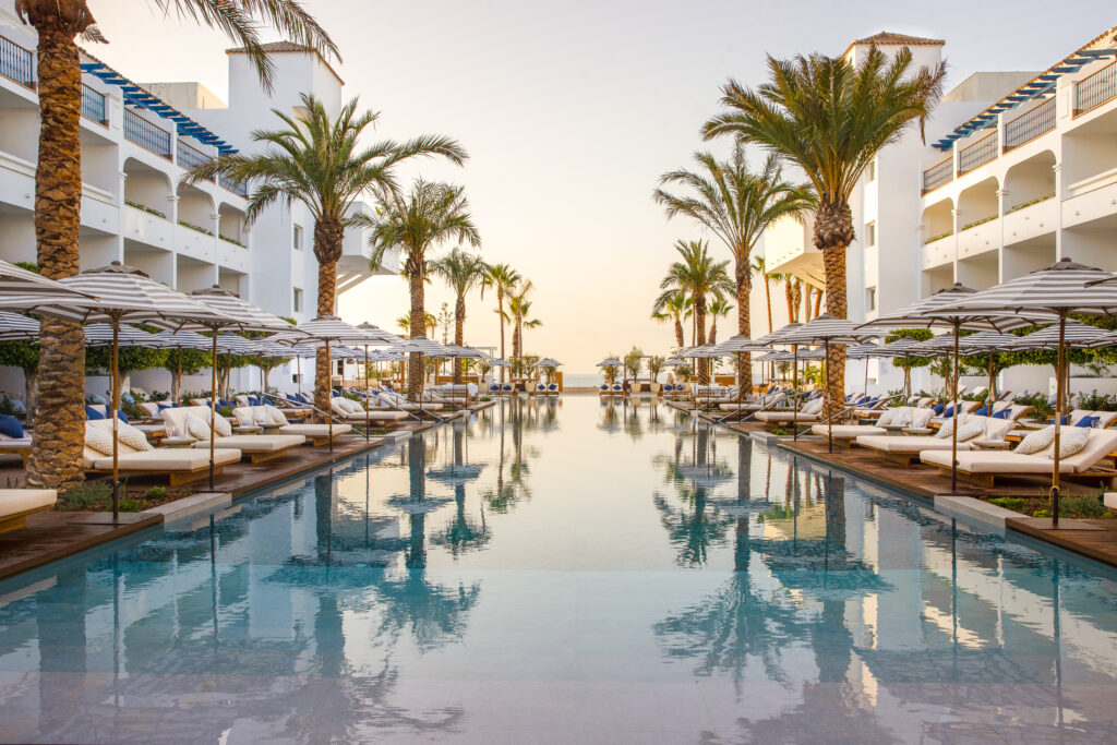 Outdoor pool at sunset at METT Hotel Beach Resort