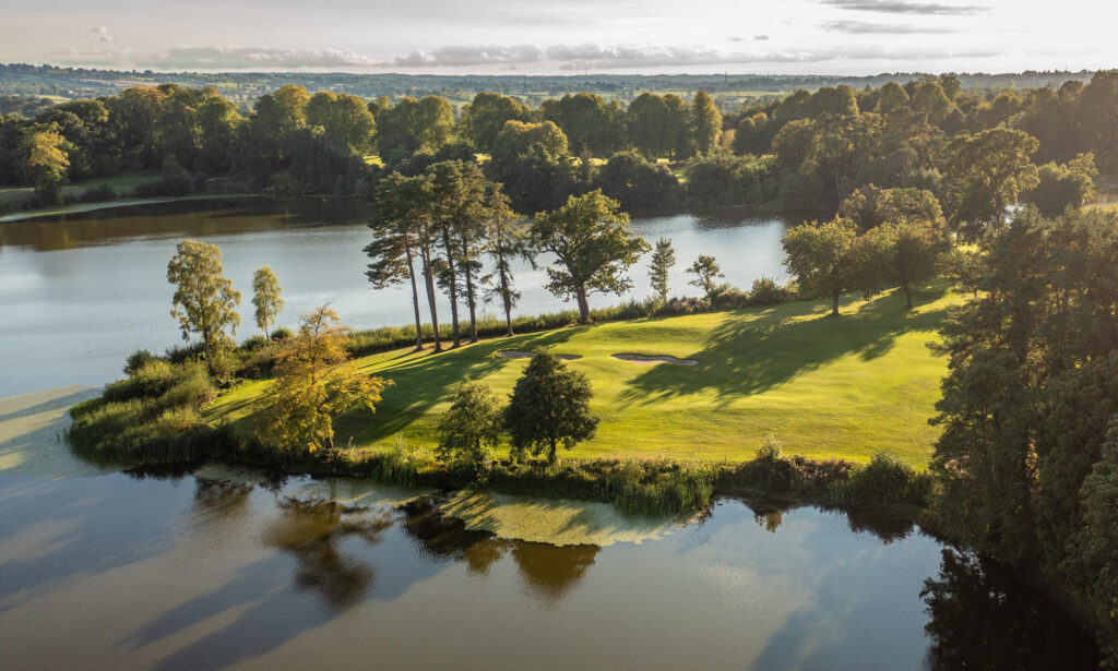 Aerial view of the lake at Malone Golf Club with trees and fairway nearby