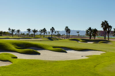 Bunker on fairway with trees in background at Mar Menor Golf Course