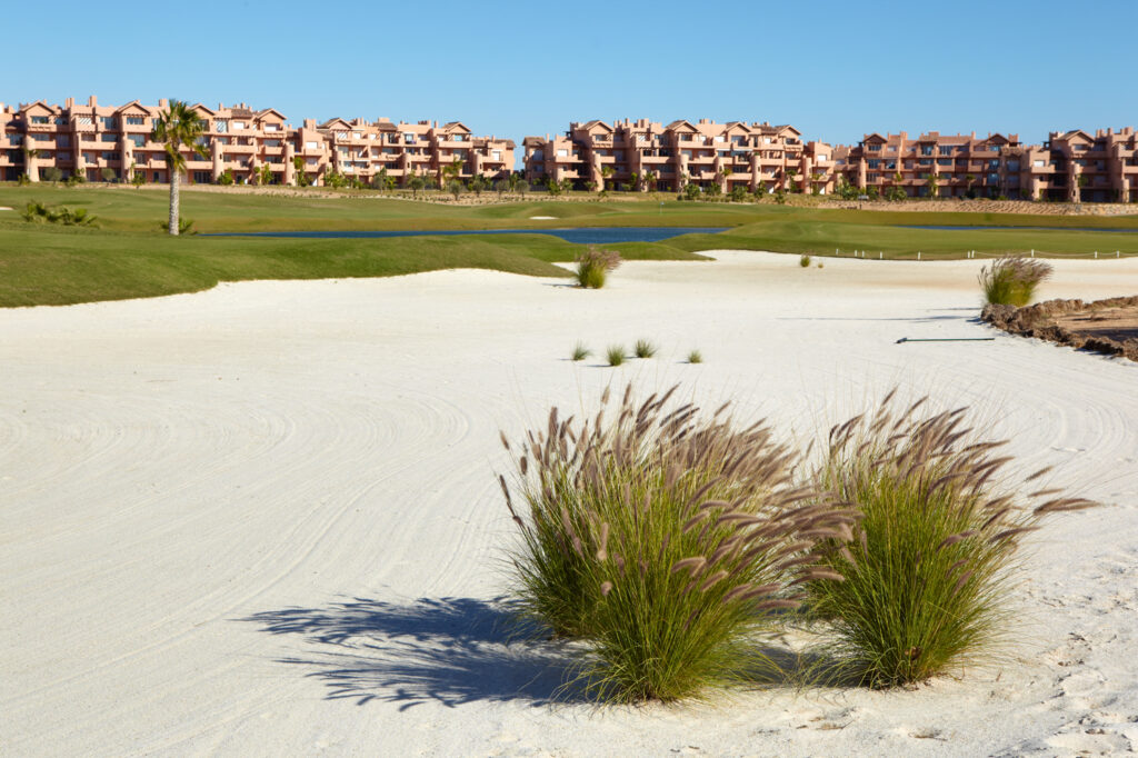 Bunker with buildings in background at Mar Menor Golf Course