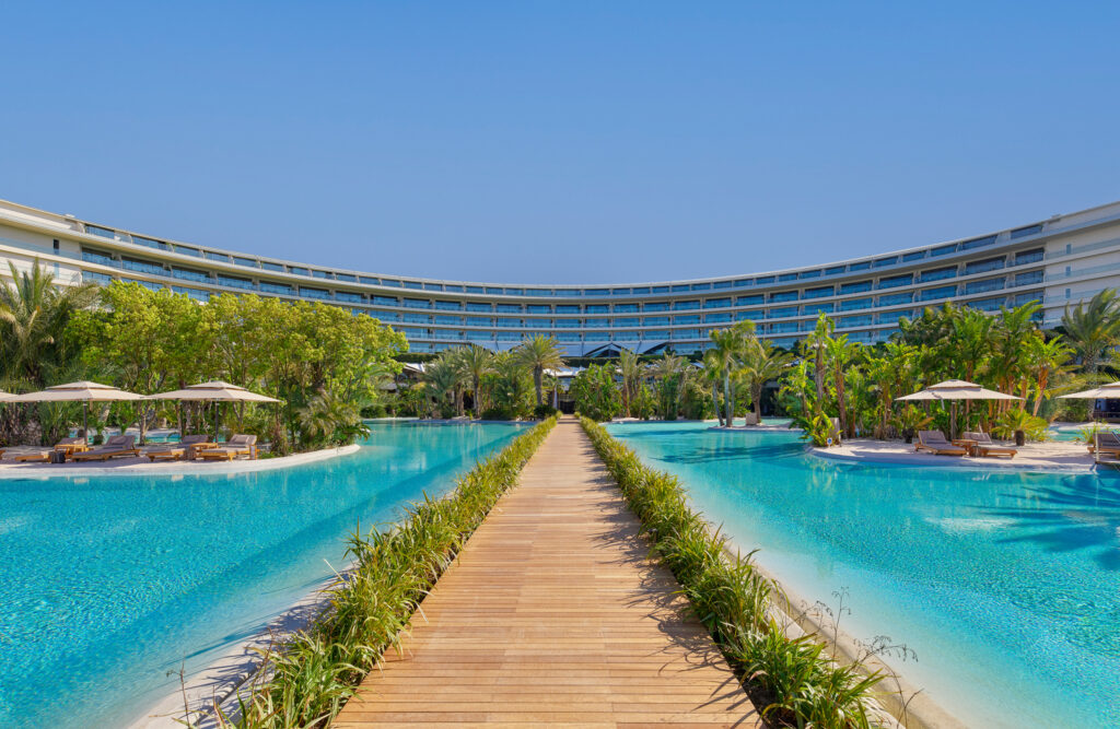 Outdoor pool with hotel in background at Maxx Royal Belek Golf Resort