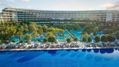 View of outdoor pools and hotel at Maxx Royal Belek Golf Resort