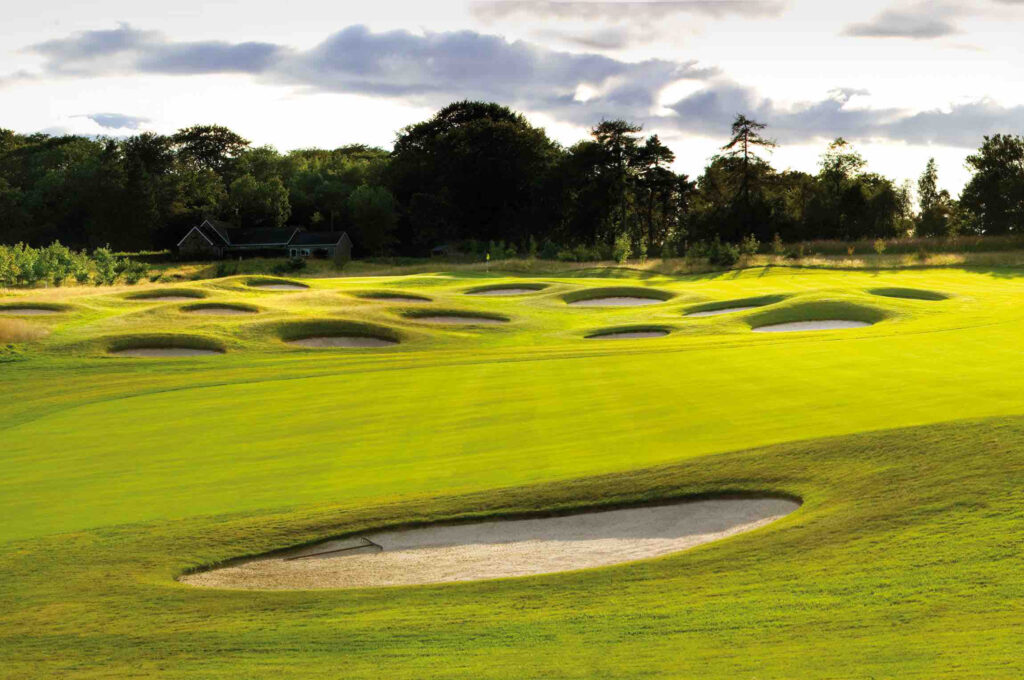 Bunkers on fairway at Meldrum House Golf Club with trees in background