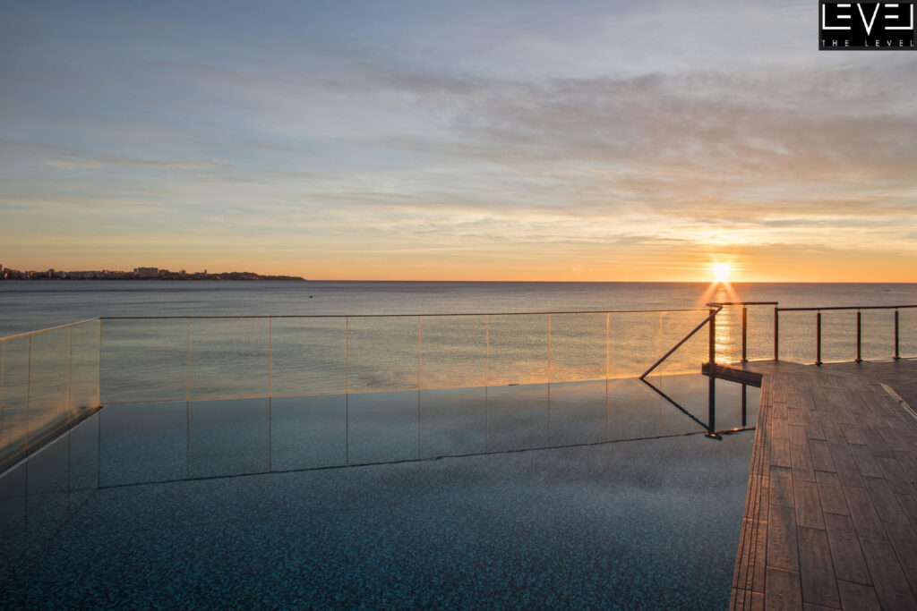 Outdoor pool with beach view at Melia Alicante