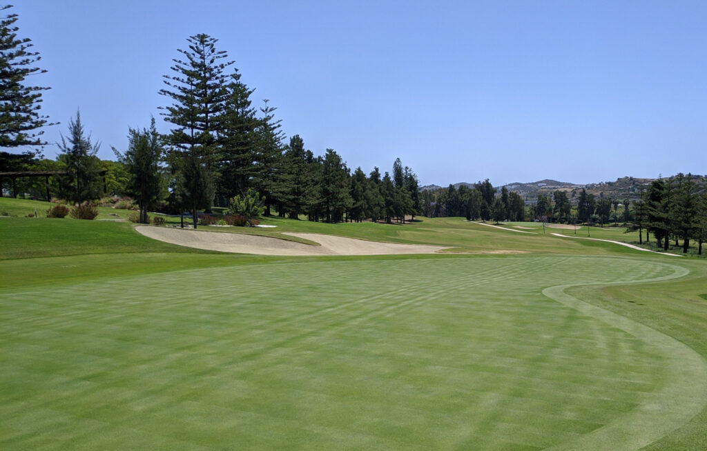 Fairway with bunkers and trees at Mijas Los Lagos Golf Course