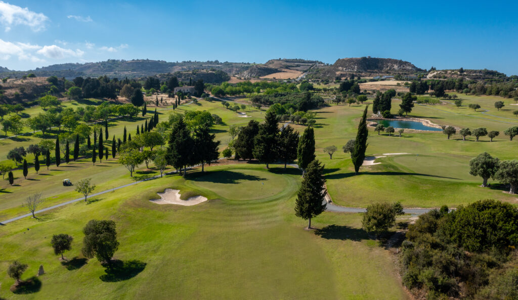 Aerial view of Minthis Golf Club course with hills in background