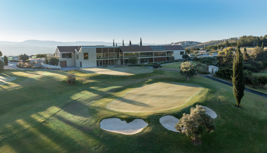 Aerial view of Minthis Golf Club with building in background