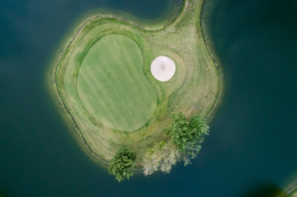 Aerial view of a hole on an island at Montado Golf Course