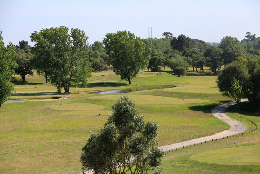 Fairway with trees and water hazard at Montado Golf Course