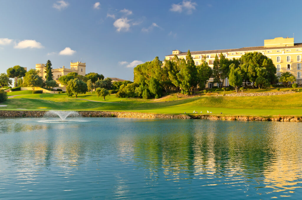 Lake with fountain and buildings in the background at Montecastillo Golf Course