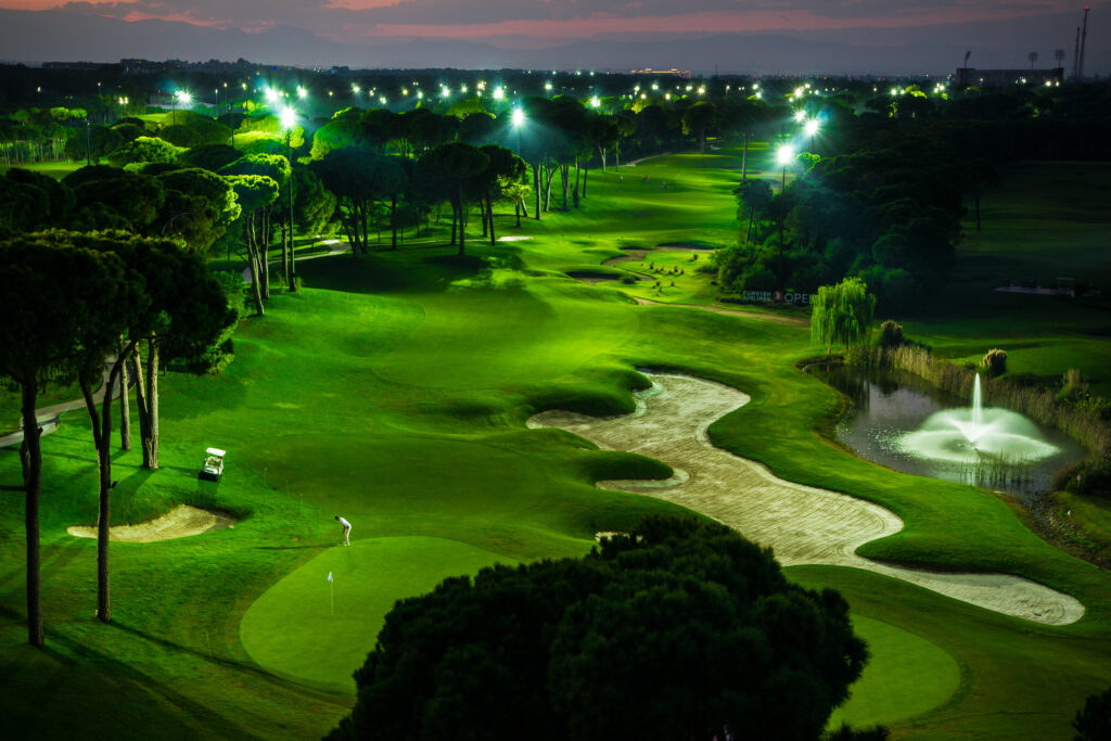 Fairway with bunkers and trees around at Montgomerie Maxx Royal Golf Course at night