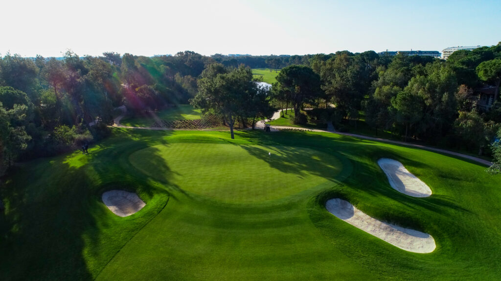 Hole with bunkers and trees around at Montgomerie Maxx Royal Golf Course