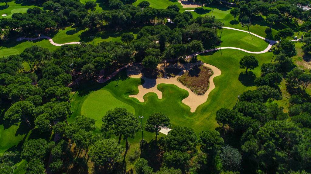 Aerial view of fairway with bunkers and trees around at Montgomerie Maxx Royal Golf Course