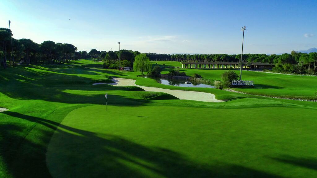 Hole with bunker and trees around at Montgomerie Maxx Royal Golf Course