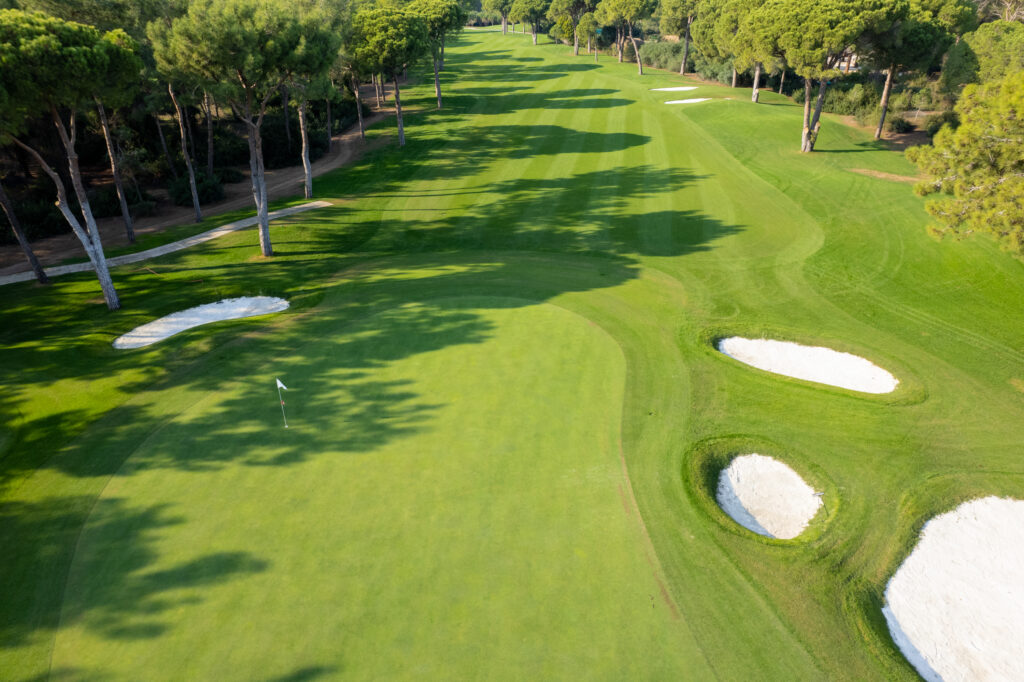 Aerial view of hole with bunkers with trees around at Nobilis Golf Course