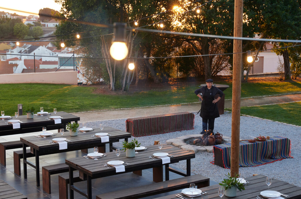 Outdoor dining with fire pit at Octant Santiago Hotel