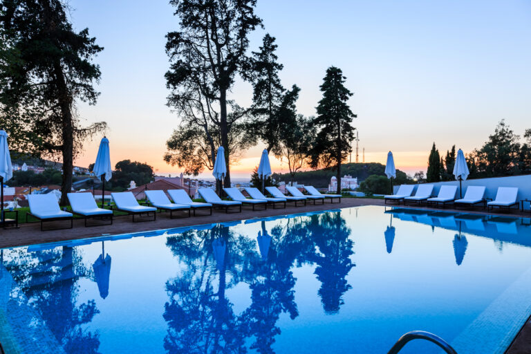 Outdoor pool with sun loungers at Octant Santiago Hotel