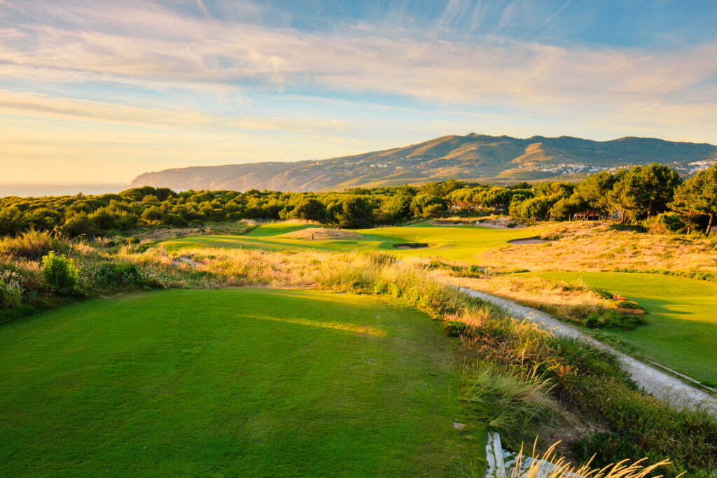 Fairway at Oitavos Dunes Golf Course with trees around