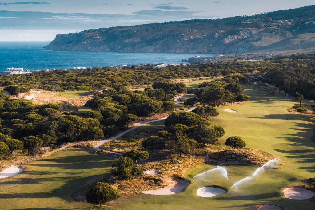 Aerial view of Oitavos Dunes Golf Course with ocean in background