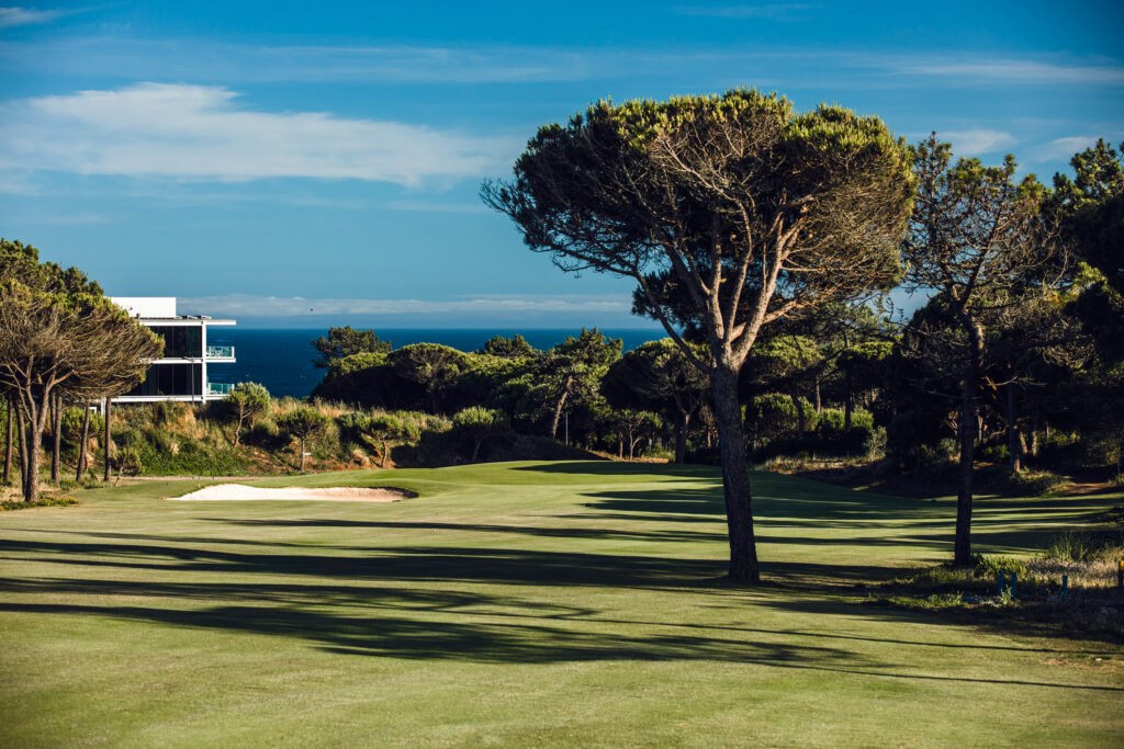 Fairway with trees and bunker at Oitavos Dunes Golf Course