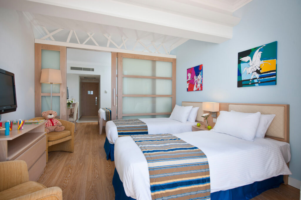 Twin bed accommodation at Olympic Lagoon Hotel