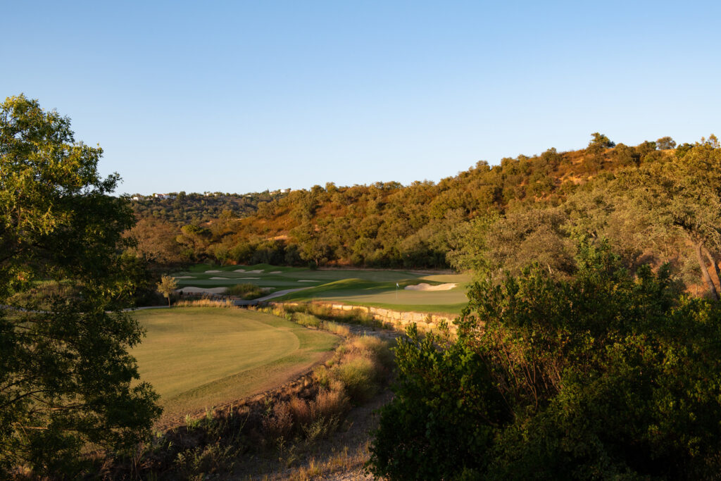 Fairway with bunkers surrounded by hillside at Ombria Golf Course