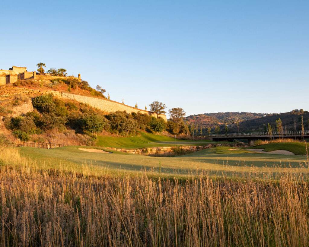 Fairway with hills in background at sunset at Ombria Golf Course