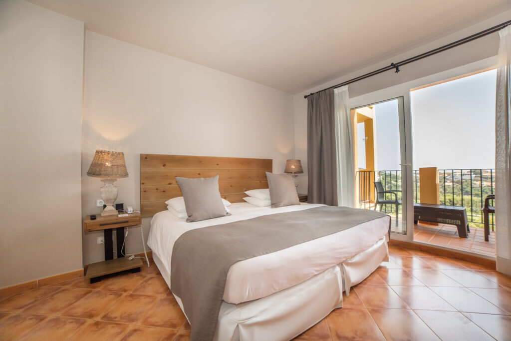 Double bed accommodation at Ona Las Lomas Village