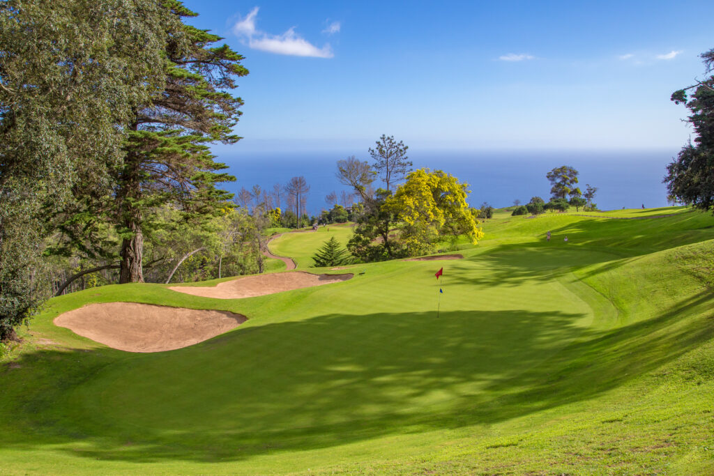 Hole at Palheiro Golf Course with trees and bunkers around