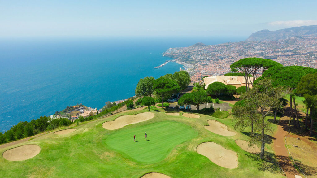 Aerial view of a hole overlooking the ocean at Palheiro Golf Course