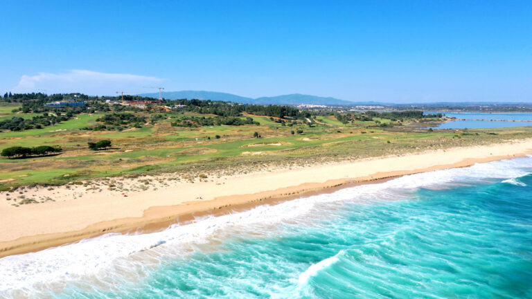 Beach at Palmares Golf Course with blue waters