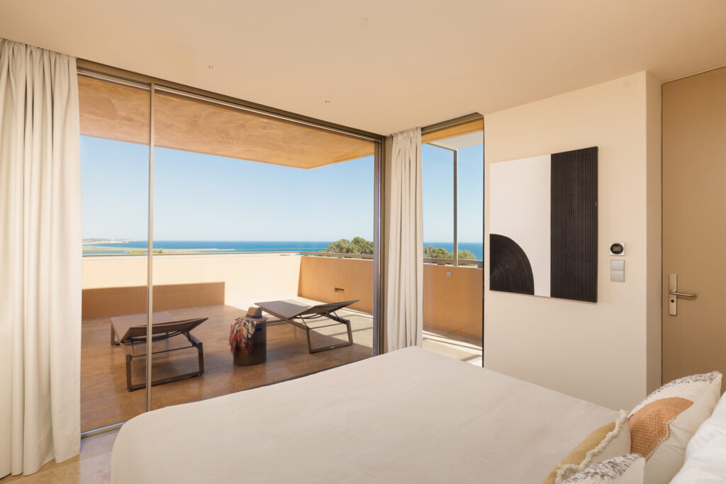 Double bed accommodation with beach view and terrace at Palmares Signature Apartments