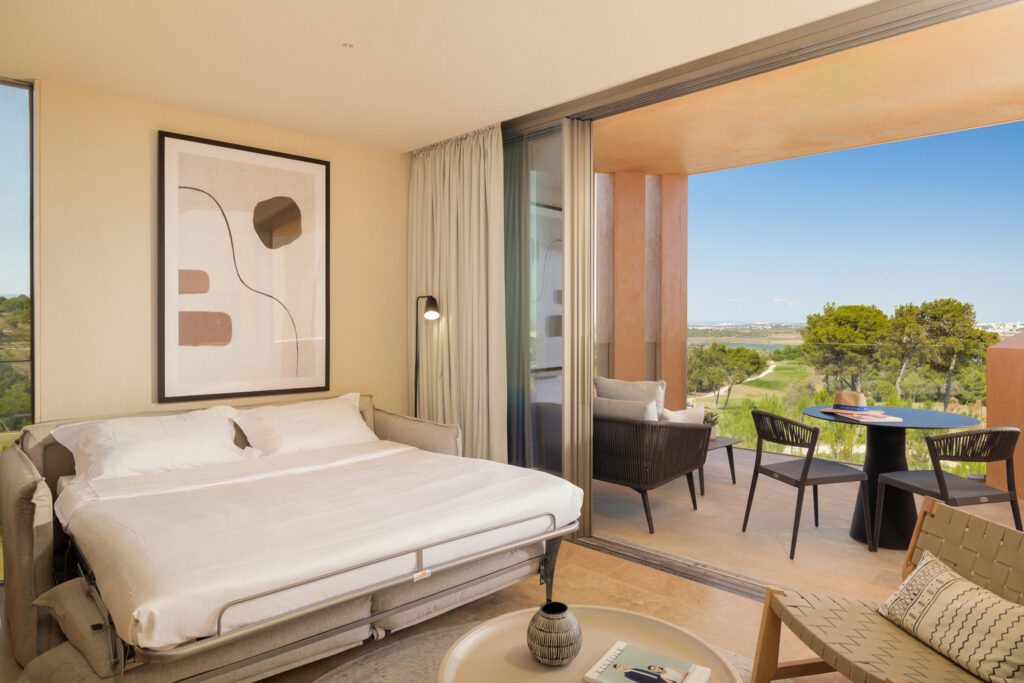 Double bed accommodation with private balcony at Palmares Signature Apartments