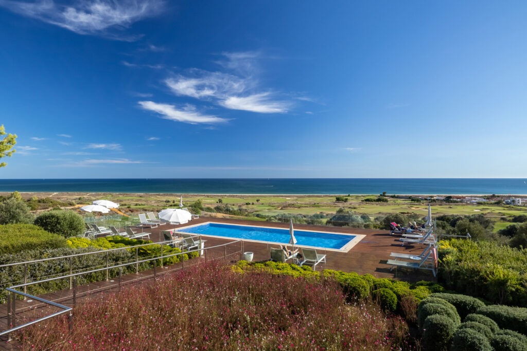 View of the outdoor pool at Palmares Beach House Hotel