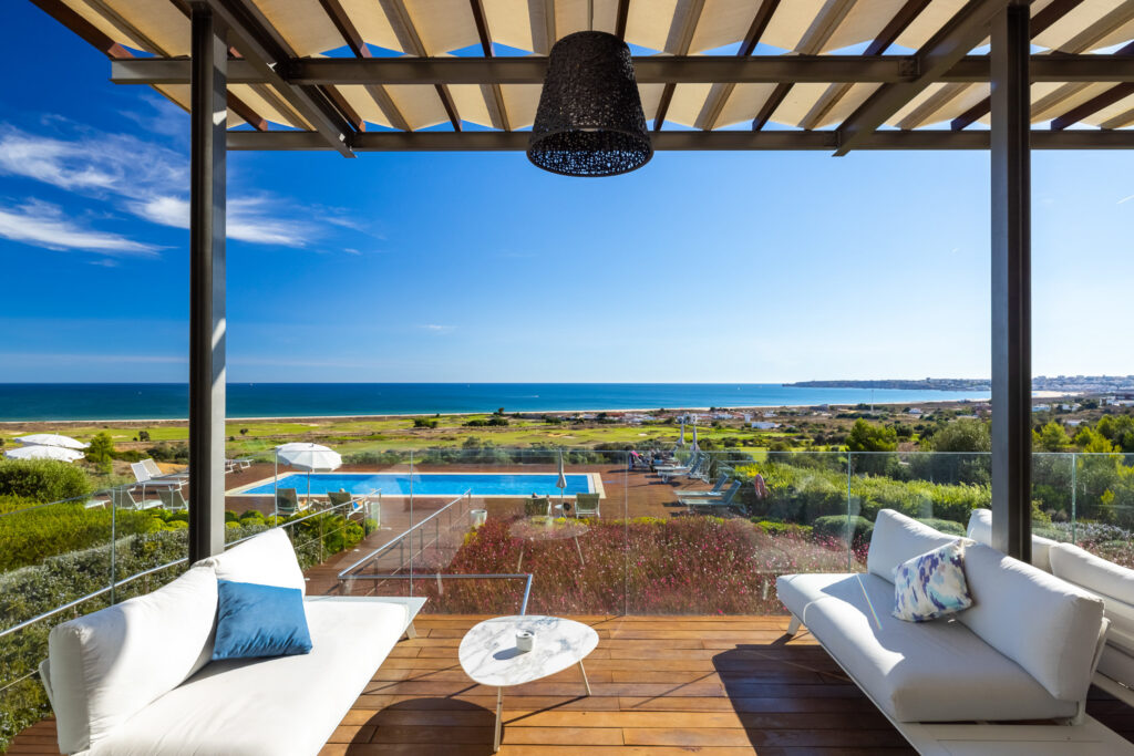 Balcony view of the pool at Palmares Beach House Hotel