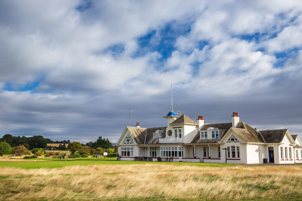 Building at Panmure Golf Club with people playing golf in front