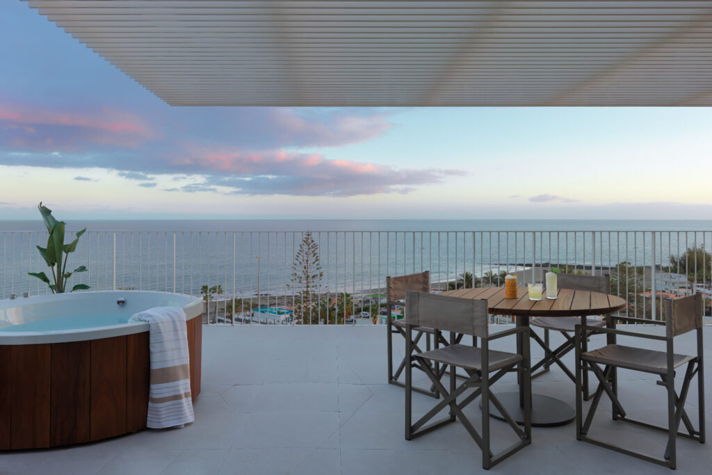 Balcony with a jacuzzi and table at Paradisus by Melia Gran Canaria