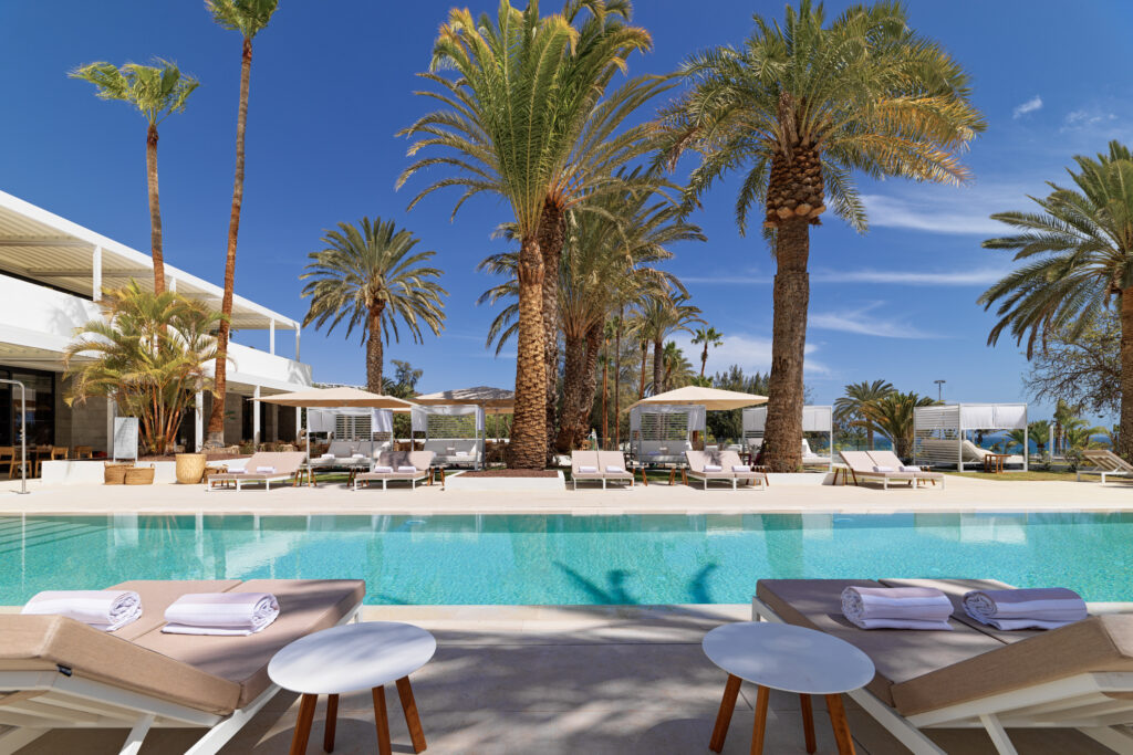 Outdoor pool with loungers at Paradisus by Melia Gran Canaria