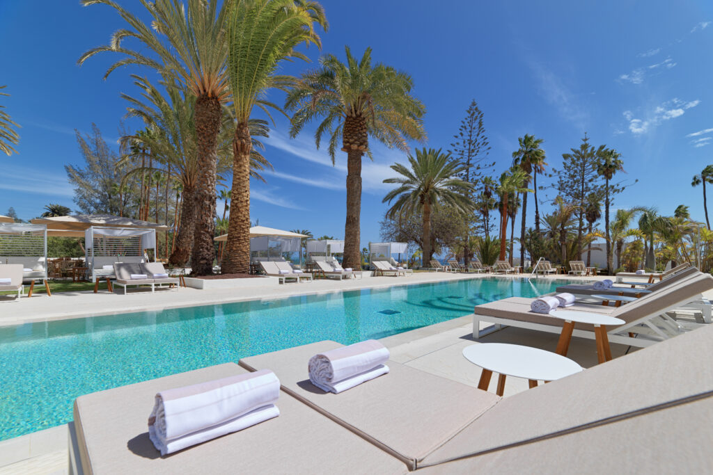 Outdoor pool with loungers at Paradisus by Melia Gran Canaria